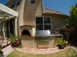 BBQ Island with pizza oven built in a backyard in Novato, California.